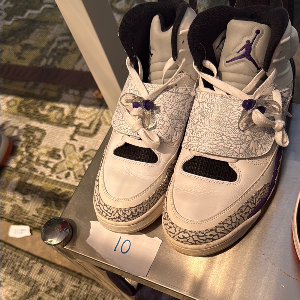 Jordan White and Purple Athletic Shoes with Iconic Design
